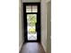 Stylish front door with a detailed iron design and transom window at 3109 W Knights Ave, Tampa, FL 33611