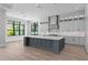 Bright, open kitchen featuring a large island, modern appliances, and ample cabinet space at 3109 W Knights Ave, Tampa, FL 33611