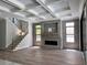 Living room featuring coffered ceiling, brick fireplace and hardwood floors at 3109 W Knights Ave, Tampa, FL 33611