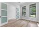 Bright office space with wood floors, large windows, and a glass-paneled door at 3109 W Knights Ave, Tampa, FL 33611