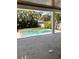 Inviting backyard pool and spa with surrounding landscaping and travertine deck at 3109 W Knights Ave, Tampa, FL 33611