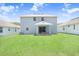 Two-story house with covered patio and large backyard at 2437 Orange Harvest Pl, Seffner, FL 33584