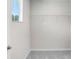Walk-in closet with wire shelving and window at 2437 Orange Harvest Pl, Seffner, FL 33584