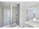 Bathroom with walk-in shower and white vanity at 2437 Orange Harvest Pl, Seffner, FL 33584
