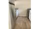 Kitchen with stainless steel appliances and wood-look flooring at 10423 Carrollbrook Cir # 201, Tampa, FL 33618