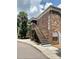Building exterior showcasing a brick facade and stairway access at 10423 Carrollbrook Cir # 201, Tampa, FL 33618