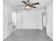 Spacious bedroom with ceiling fan and access to other rooms at 2927 Minuteman Ln, Brandon, FL 33511