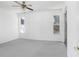 Bright bedroom with ceiling fan and access to backyard at 2927 Minuteman Ln, Brandon, FL 33511