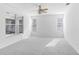 Large bedroom with ceiling fan and carpet flooring at 2927 Minuteman Ln, Brandon, FL 33511