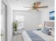 Bright bedroom with a ceiling fan and window coverings at 2927 Minuteman Ln, Brandon, FL 33511