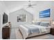 Main bedroom with vaulted ceiling and large window at 2927 Minuteman Ln, Brandon, FL 33511
