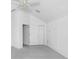 Spacious bedroom with vaulted ceiling, ceiling fan, and grey carpet at 2927 Minuteman Ln, Brandon, FL 33511