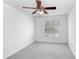 Simple bedroom with ceiling fan and window with blinds at 2927 Minuteman Ln, Brandon, FL 33511