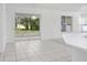 Bright dining area with tile floors and sliding glass doors leading to the backyard at 2927 Minuteman Ln, Brandon, FL 33511