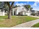 Two-story house with attached garage and lush landscaping at 2927 Minuteman Ln, Brandon, FL 33511