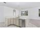 Modern kitchen with white quartz countertops and gray cabinets at 2927 Minuteman Ln, Brandon, FL 33511