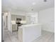 Kitchen features island, stainless steel appliances, and light cabinets at 2927 Minuteman Ln, Brandon, FL 33511