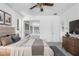 Main bedroom with a king bed and access to the backyard at 2927 Minuteman Ln, Brandon, FL 33511