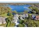 Luxury waterfront home with expansive lake views and lush landscaping at 806 Taray De Avila, Tampa, FL 33613
