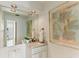 Small bathroom with single vanity and marble countertop at 806 Taray De Avila, Tampa, FL 33613