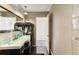 Modern bathroom with curved vanity and glass countertop at 806 Taray De Avila, Tampa, FL 33613