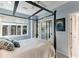 Guest bedroom with four-poster bed and mirrored closet at 806 Taray De Avila, Tampa, FL 33613