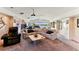 Gathering room with a large sectional sofa, a projector, and lake views at 806 Taray De Avila, Tampa, FL 33613