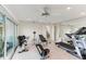 Bright home gym with various exercise equipment including treadmill and weight machine at 806 Taray De Avila, Tampa, FL 33613