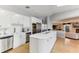 Modern kitchen with white cabinets, stainless steel appliances, and an island at 806 Taray De Avila, Tampa, FL 33613
