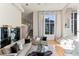 Sunlit living area with large windows and hardwood floors at 806 Taray De Avila, Tampa, FL 33613