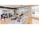 Bright living room with hardwood floors, comfortable seating, and views of the lake at 806 Taray De Avila, Tampa, FL 33613