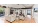 Spacious living room with a fireplace, large windows, and comfortable seating at 806 Taray De Avila, Tampa, FL 33613