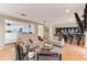 Open living space with two sofas, a wet bar, and a view into the kitchen at 806 Taray De Avila, Tampa, FL 33613