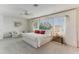 Luxurious main bedroom with a king-size bed and water views at 806 Taray De Avila, Tampa, FL 33613