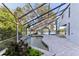 Inviting screened pool and patio area overlooking the lake at 806 Taray De Avila, Tampa, FL 33613