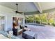 Spacious pool patio with seating area and access to the pool and lake at 806 Taray De Avila, Tampa, FL 33613