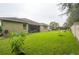Green grassy backyard with view of home's back at 903 Heritage Groves Dr, Brandon, FL 33510