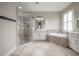 Bathroom with corner shower, soaking tub, and white cabinets at 903 Heritage Groves Dr, Brandon, FL 33510