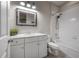 Bathroom boasts a bathtub, shower, and white vanity at 903 Heritage Groves Dr, Brandon, FL 33510