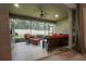 Relaxing screened lanai with wicker furniture and view of backyard at 903 Heritage Groves Dr, Brandon, FL 33510