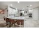 Modern kitchen with curved island and seating at 903 Heritage Groves Dr, Brandon, FL 33510