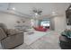 Spacious living room with gray and red sofas and a ceiling fan at 903 Heritage Groves Dr, Brandon, FL 33510