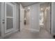 Hallway with doors to bedrooms and bathroom with grey walls at 903 Heritage Groves Dr, Brandon, FL 33510