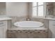 Bathroom featuring a luxurious round soaking tub at 903 Heritage Groves Dr, Brandon, FL 33510
