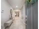 Bright and spacious entryway with tile flooring and a bench at 903 Heritage Groves Dr, Brandon, FL 33510