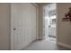 Clean bathroom with a white vanity and view of closet at 903 Heritage Groves Dr, Brandon, FL 33510