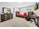 Comfortable bedroom features a large window, carpet, and ample space for relaxing and sleeping at 11946 Brighton Knoll Loop, Riverview, FL 33579