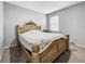 Bedroom featuring a large bed, carpet, and a bright window with natural lighting at 11946 Brighton Knoll Loop, Riverview, FL 33579