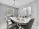 Elegant dining room with a unique table and chandelier at 11946 Brighton Knoll Loop, Riverview, FL 33579