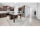 Modern kitchen features stainless steel appliances, granite countertops, and a spacious center island at 11946 Brighton Knoll Loop, Riverview, FL 33579